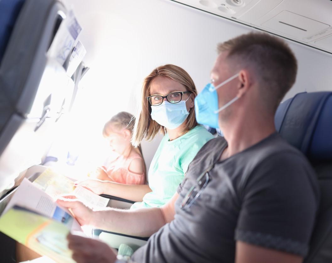 Couple wearing masks on plane