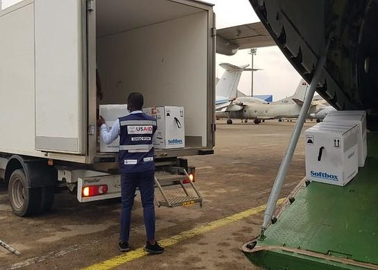 Loading COVID vaccine onto truck at airport