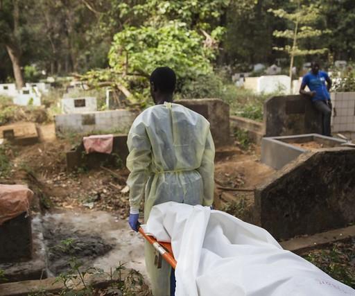 Ebola body on stretcher at cemetary
