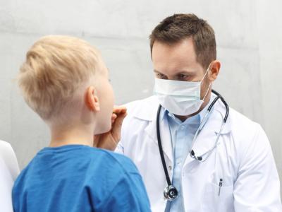 Throat exam of young boy