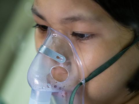 Girl receiving supplemental oxygen