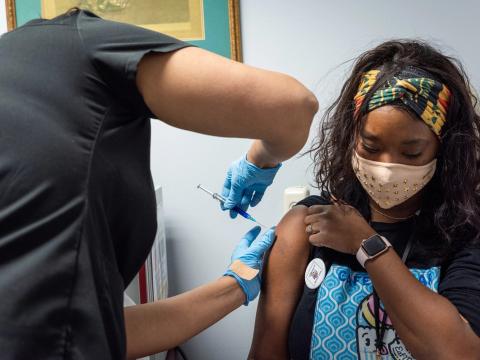Teen getting vaccinated