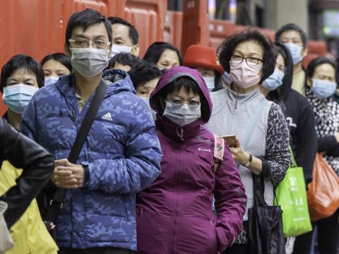 Hong Kong crowd wearing masks