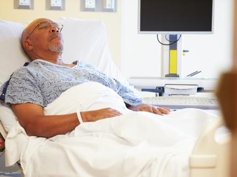 Older man in hospital bed