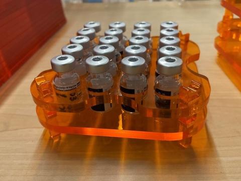 Vaccine vials in orange tray