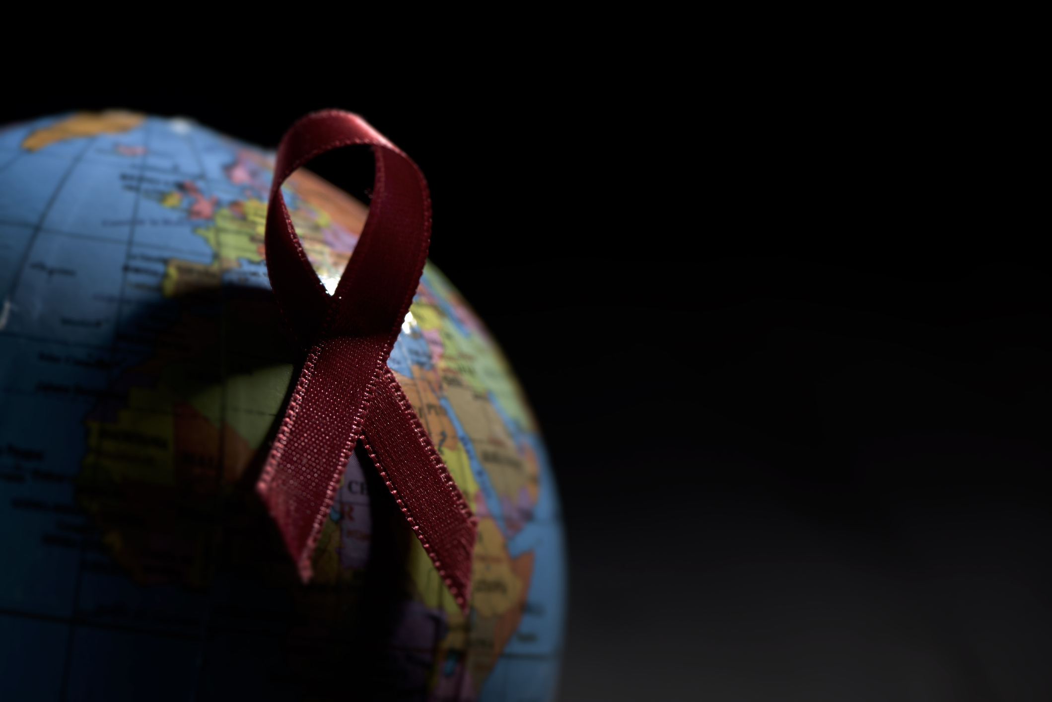 Globe and AIDS ribbon