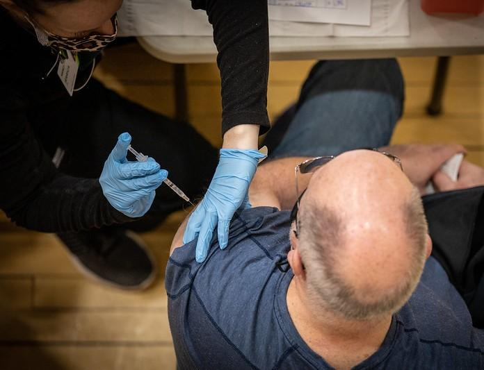 Aerial view of man getting vaccinated
