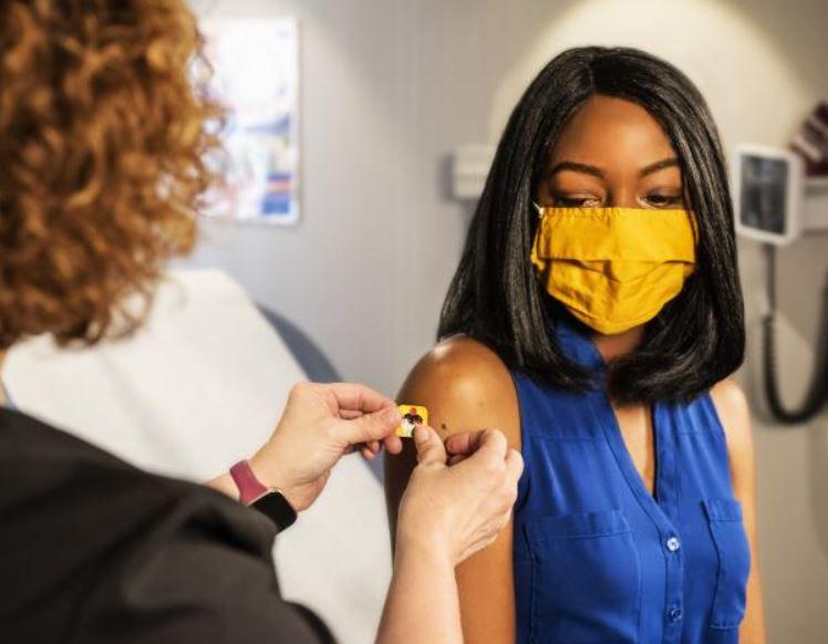 Woman receiving vaccine