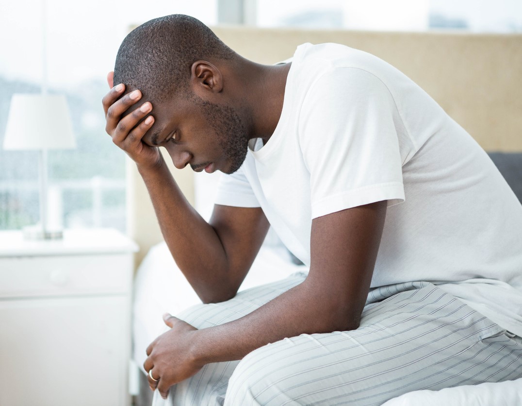 Ailing man on bedside