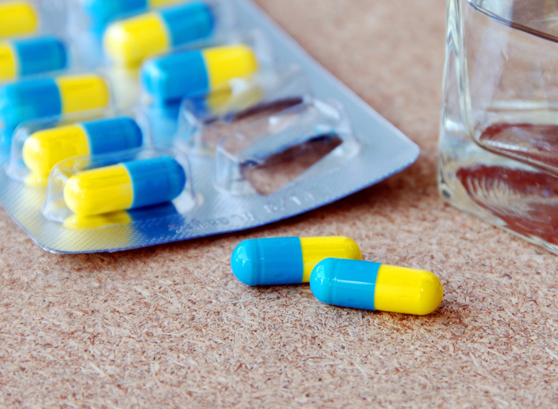 Blue and yellow capsules