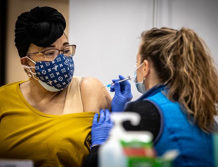 Woman getting vaccinated against COVID