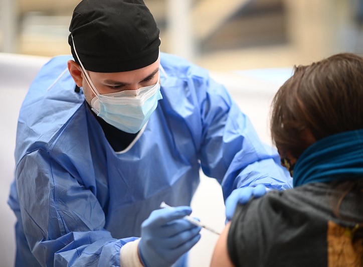 Woman getting vaccinated against COVID-19