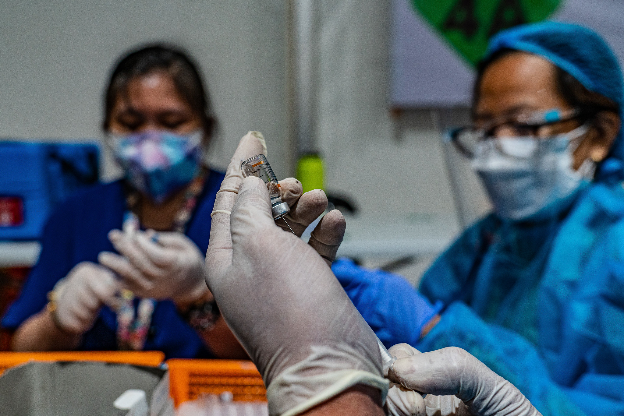 Nurses drawing up vaccines