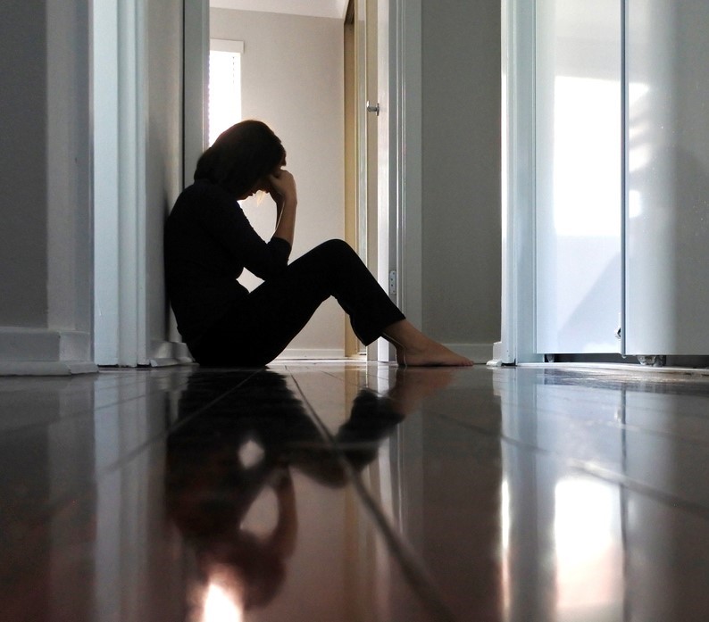 Fatigued woman on floor