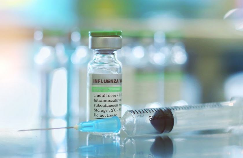 Flu vaccine vial and syringe
