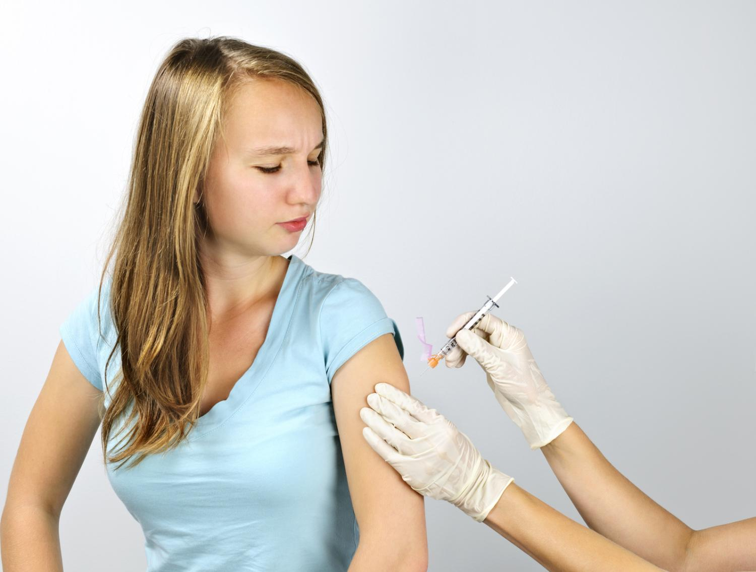 Girl being vaccinated