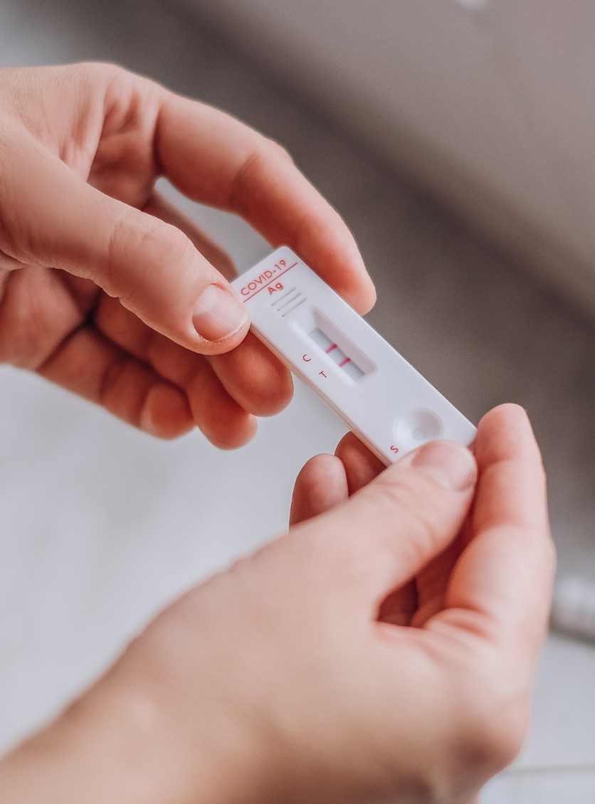 Hands holding rapid covid test