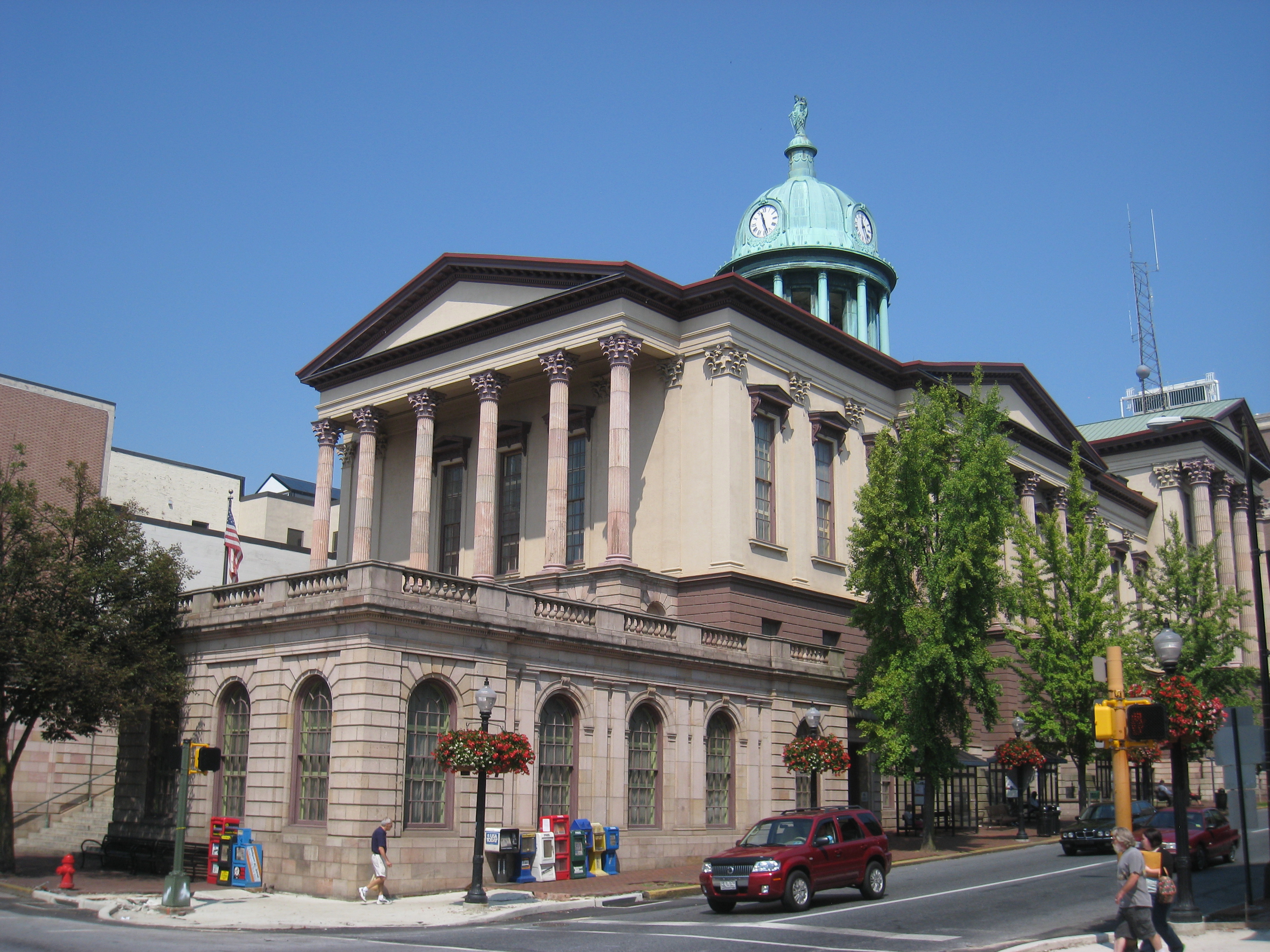 Lancaster County Courthouse on a corner in downtown Lancaster, PA. The 1850s building has a copper dome, turned green with oxidation. It was built with sandstone from a nearby quarry.