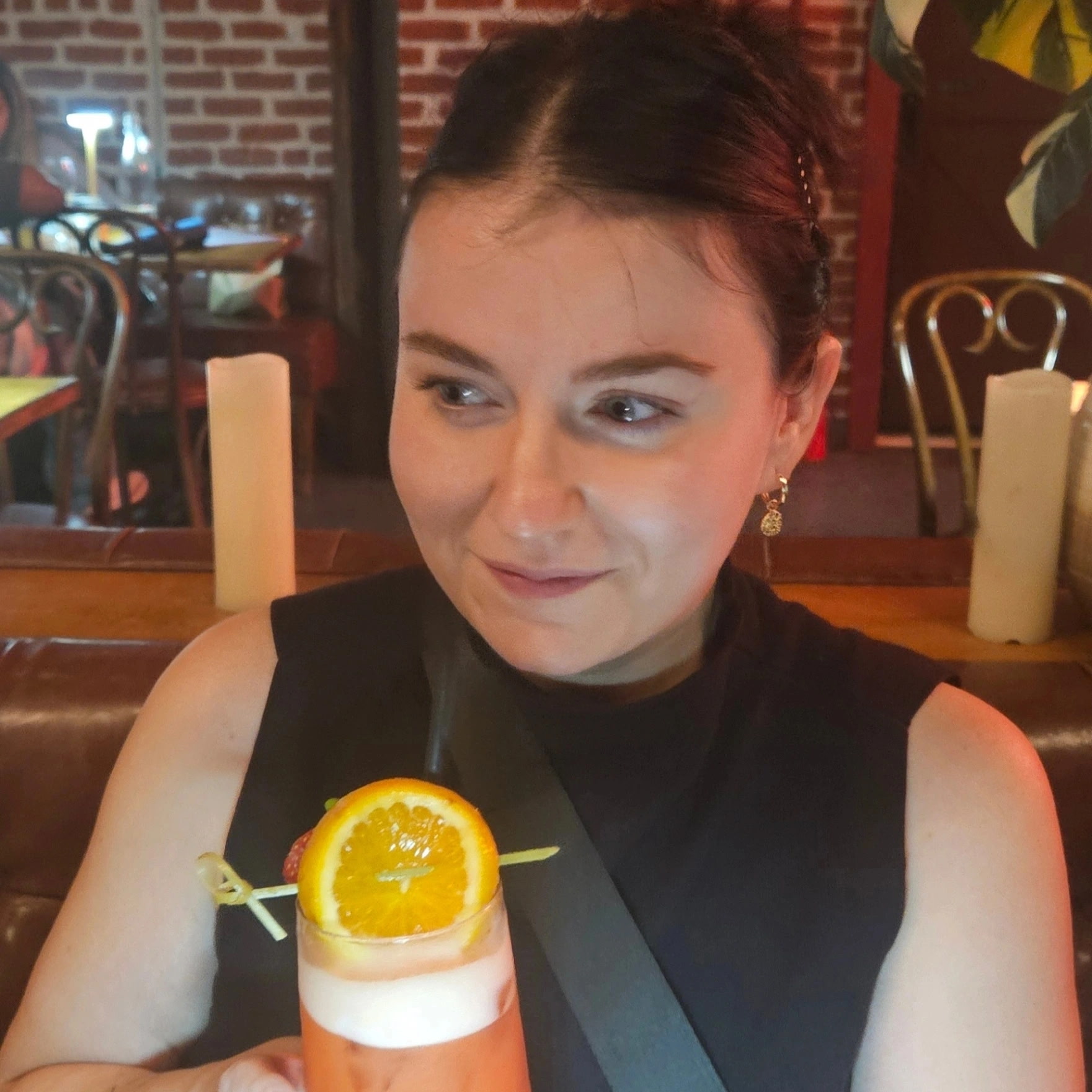 White woman sitting at a table in a restaurant