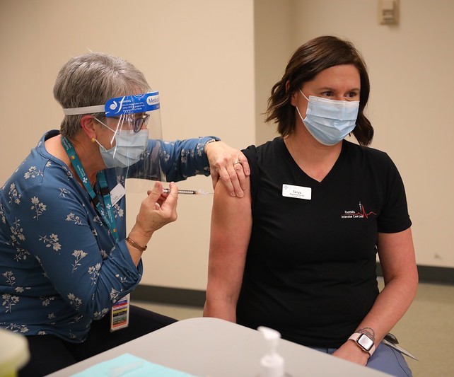 Nurse getting vaccinated