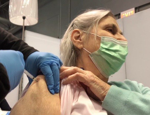 Older woman getting COVID vaccine