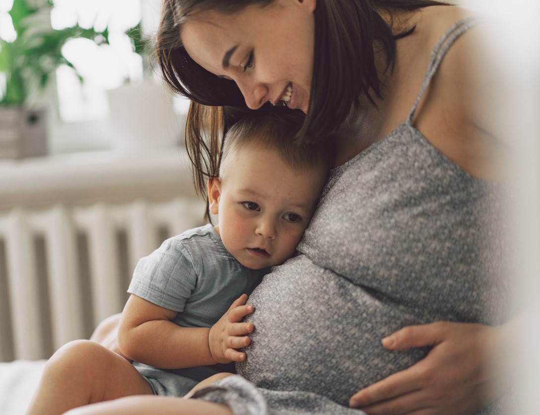 Pregnant woman with young child