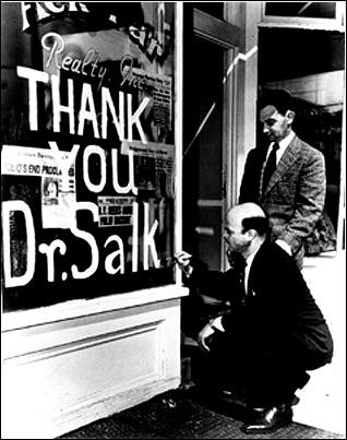 A man writes "Thank you, Dr. Salk" on his shop window in 1955.