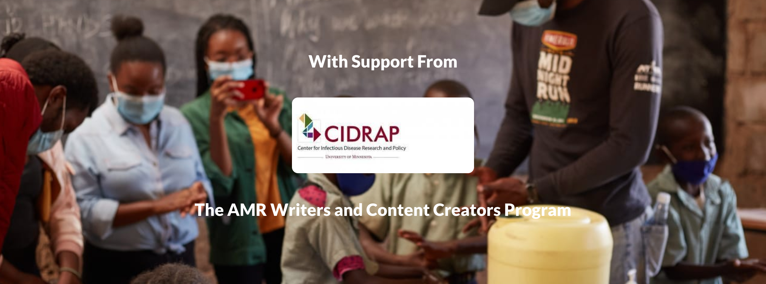 Eight people wearing medical masks stand in a circle and text reads "With support from CIDRAP: The AMR Writers and Content Creators Program"