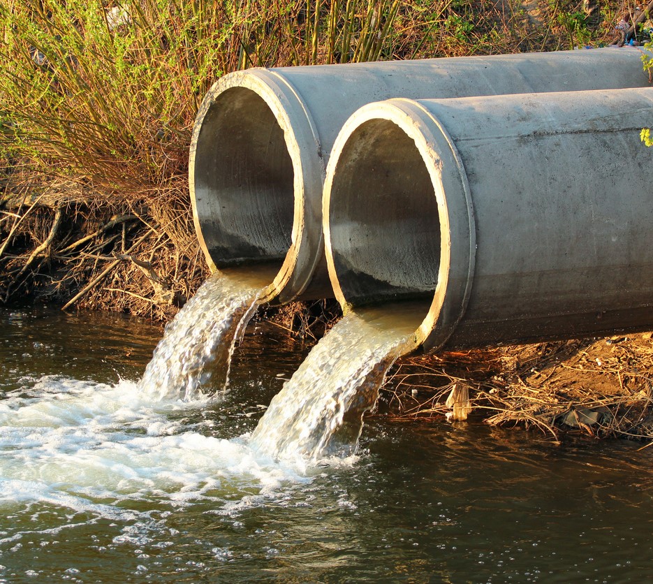 Sewer discharging wastewater into river