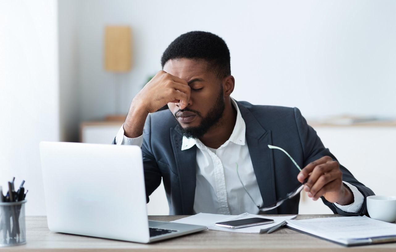 Stressed man working