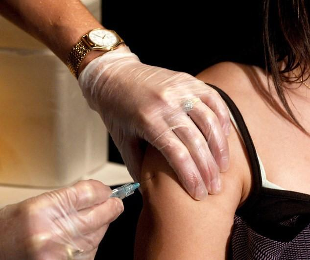 Young woman receiving vaccine dose