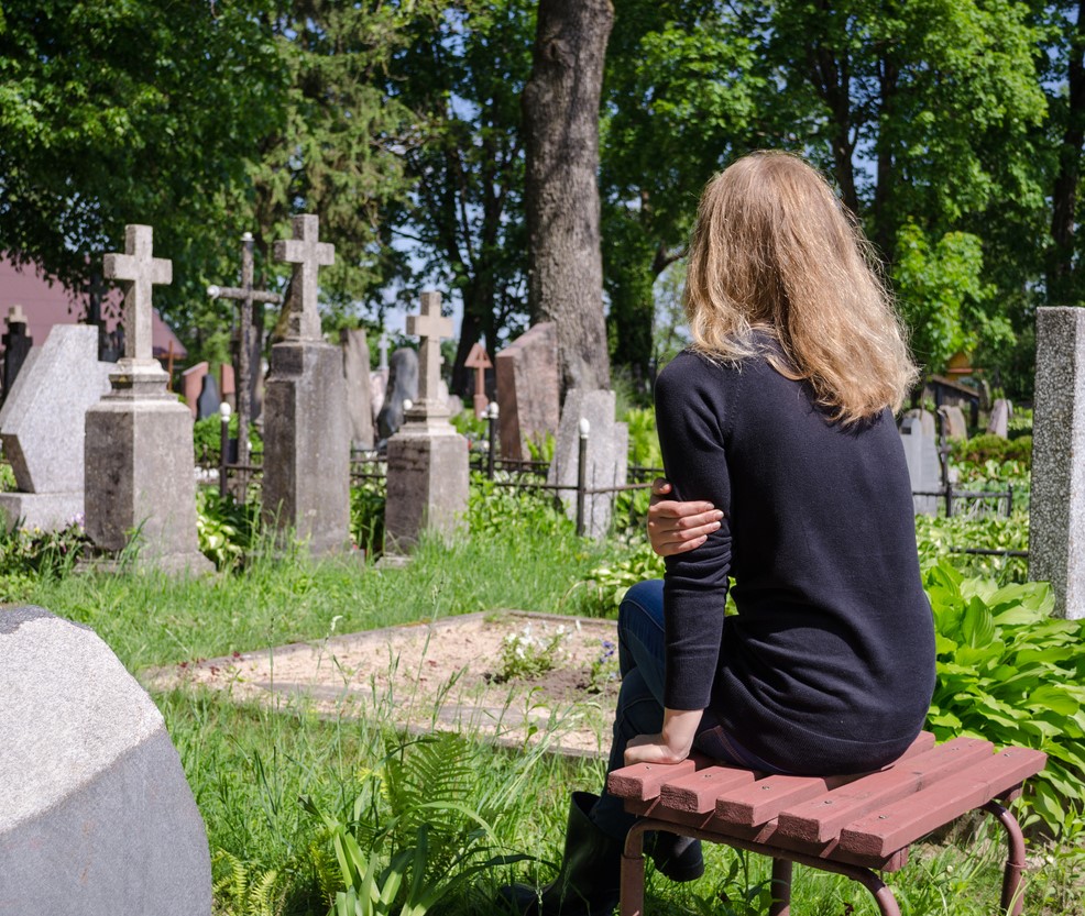 woman at graveside