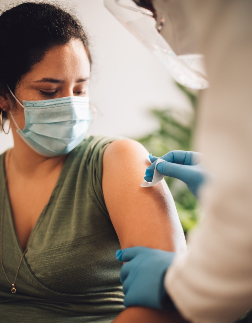 Woman getting prepped for vaccine
