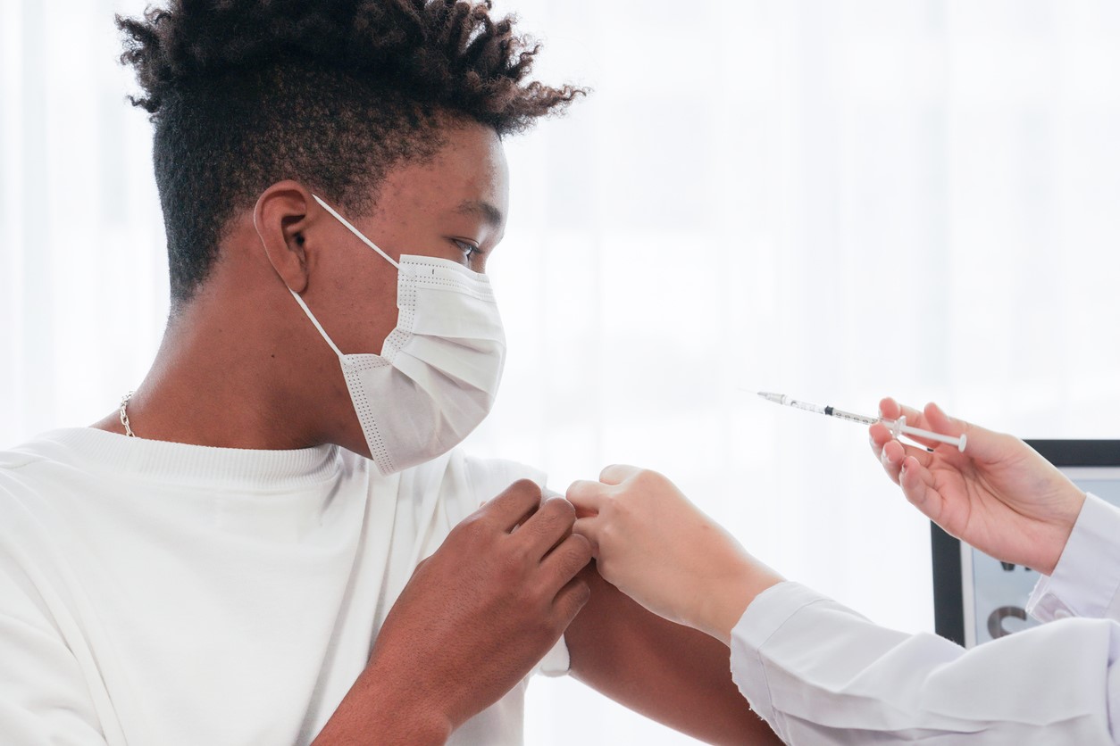 Young man getting vaccine