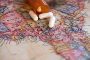 Several capsules on a paper map of Africa