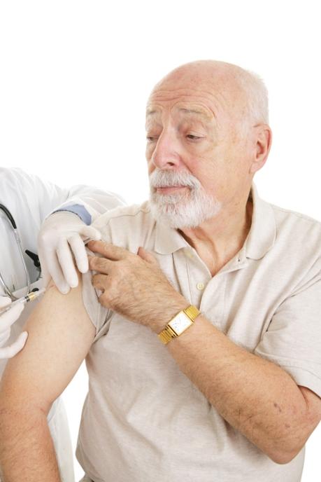 Elderly man receives flu shot