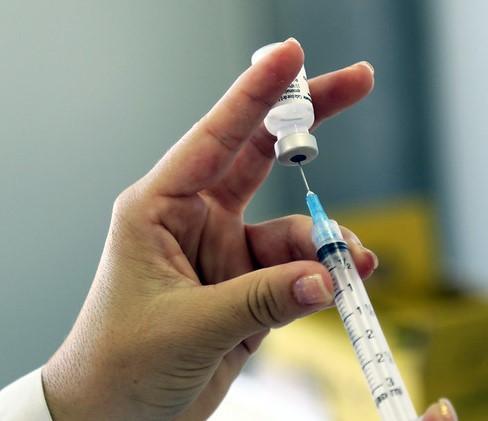 Vaccine being drawn into syringe