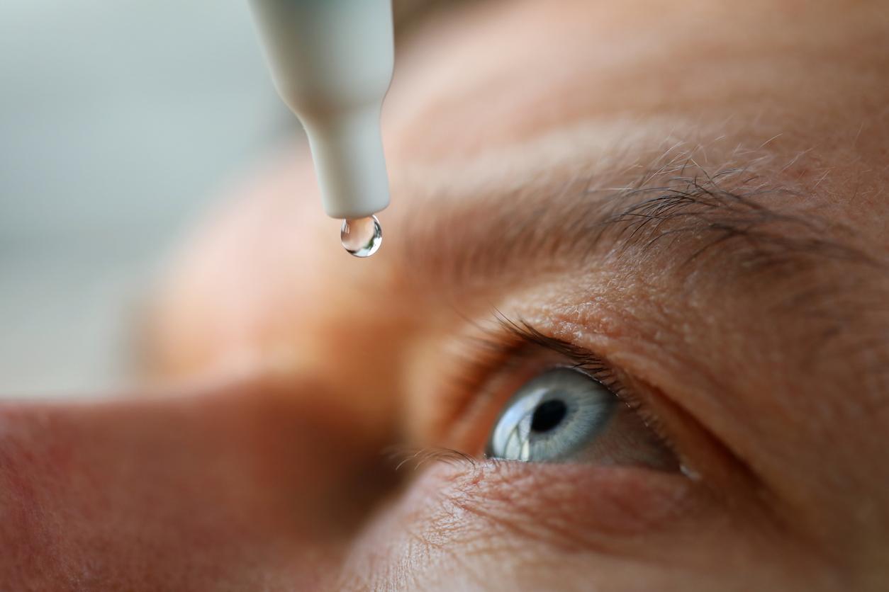 Person using eye drops