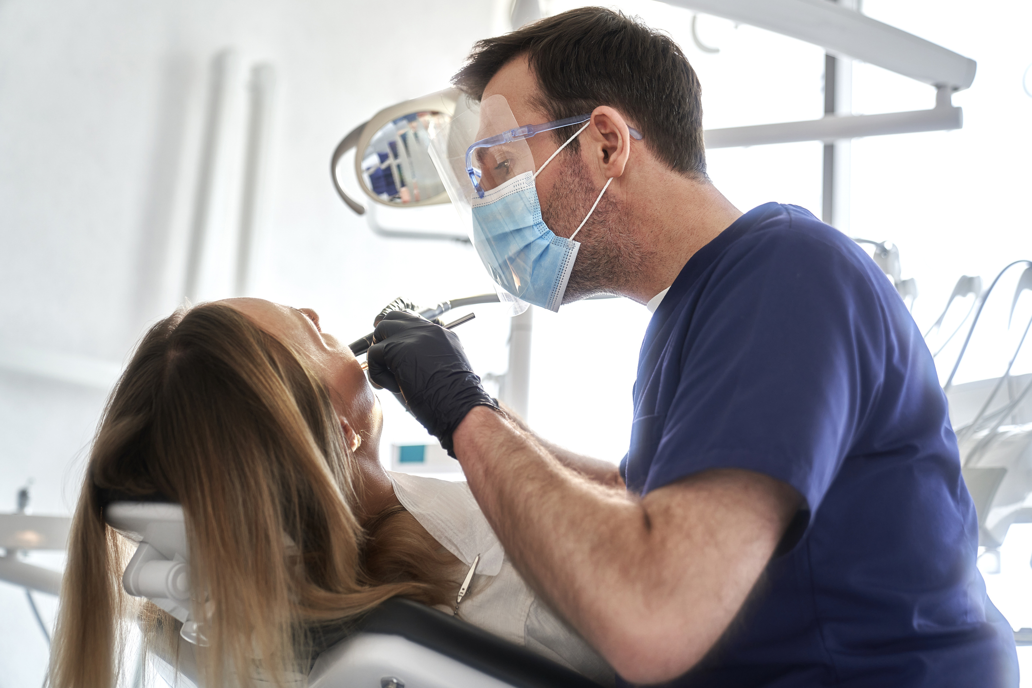 Dentist performing procedure