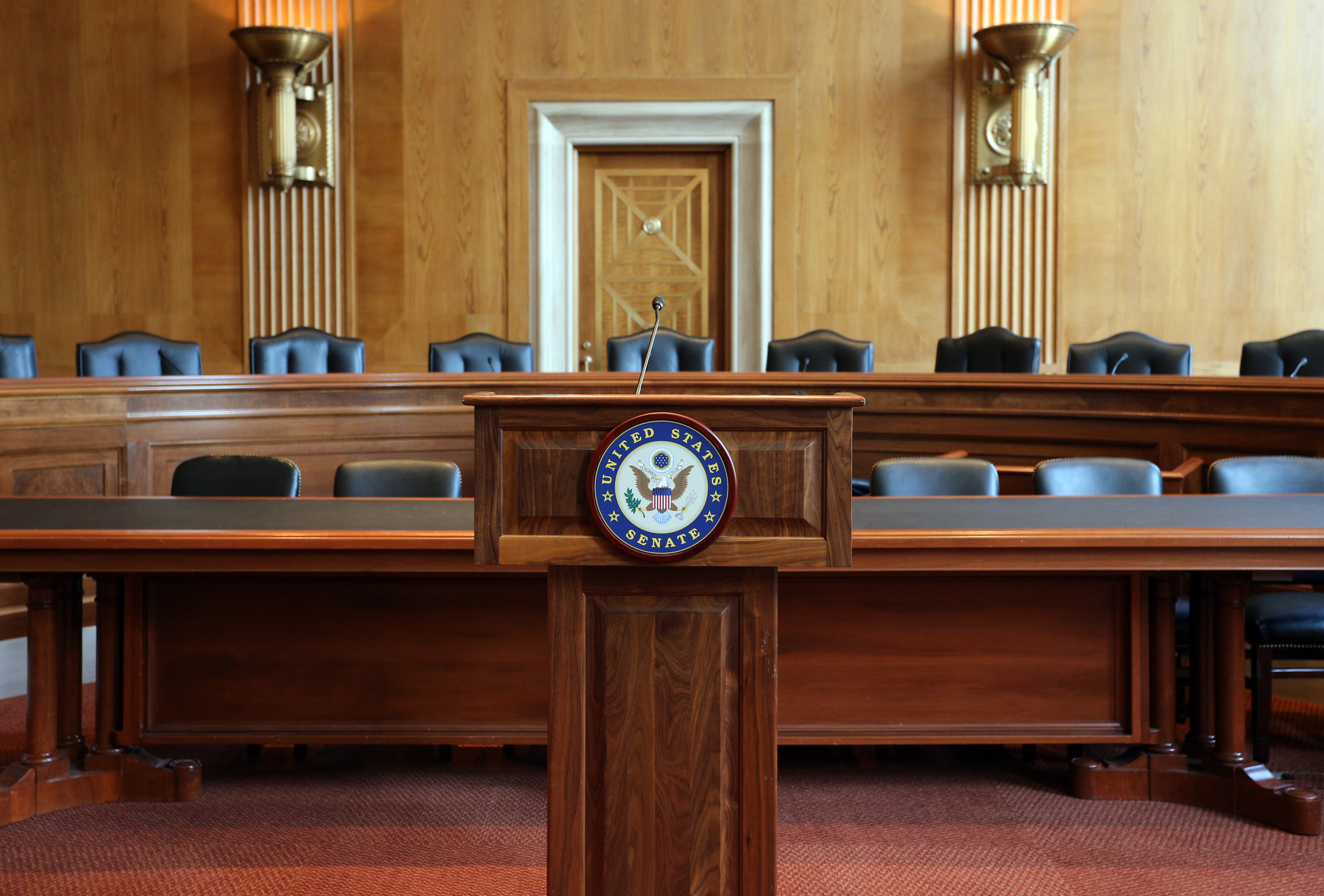 Senate committee room with empty chairs