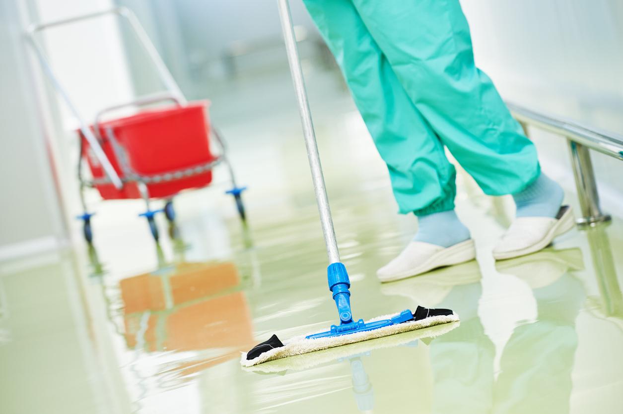 Nurse cleaning floor