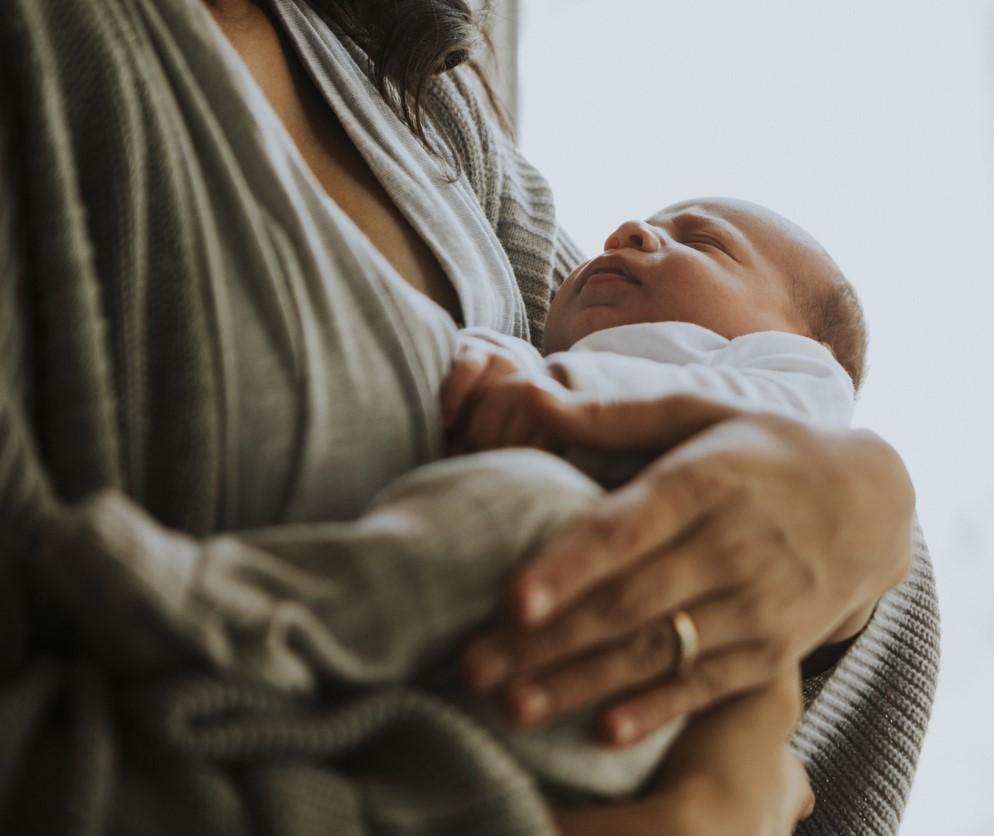 mom holding baby