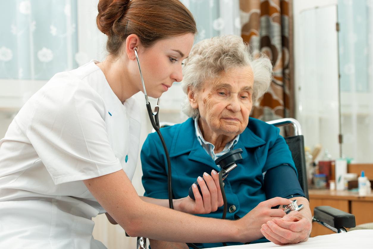 Nurse with patient in nursing home