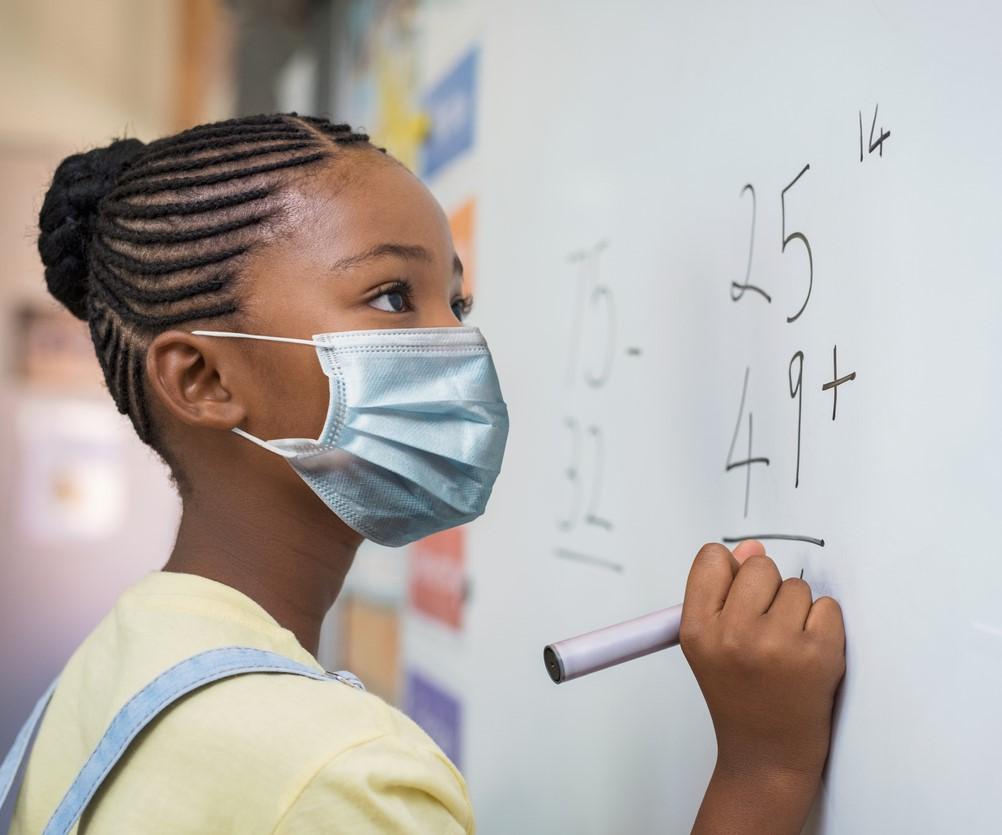 school girl wearing mask