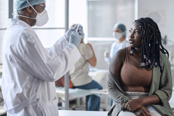 Doctor about to vaccinate woman