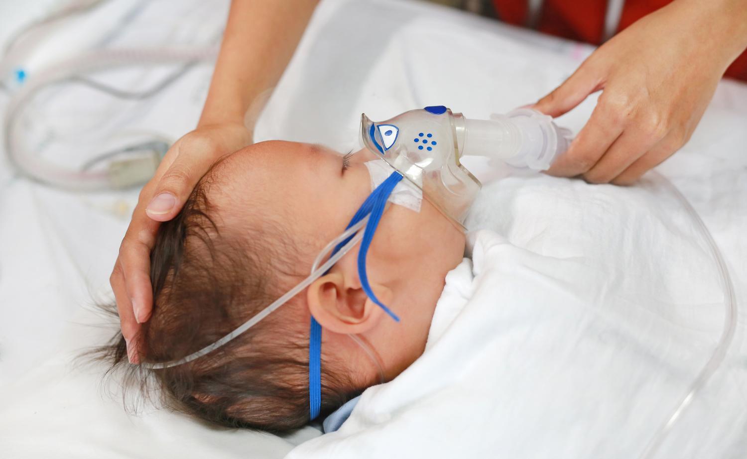 baby using nebulizer