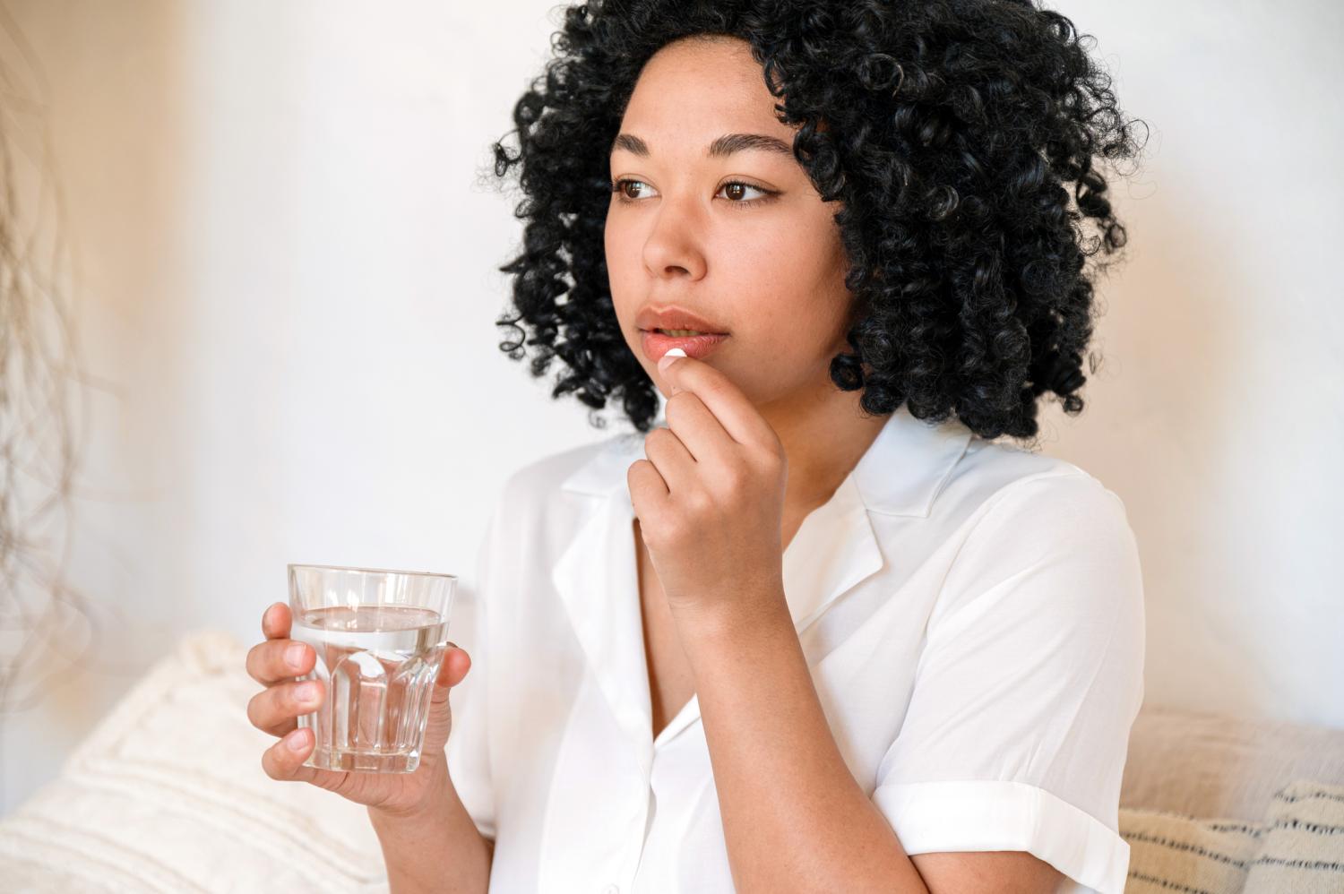 Woman taking pill