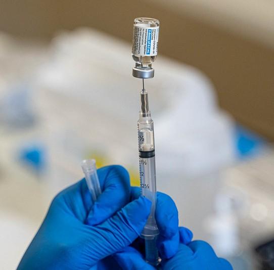 COVID vaccine vial and syringe
