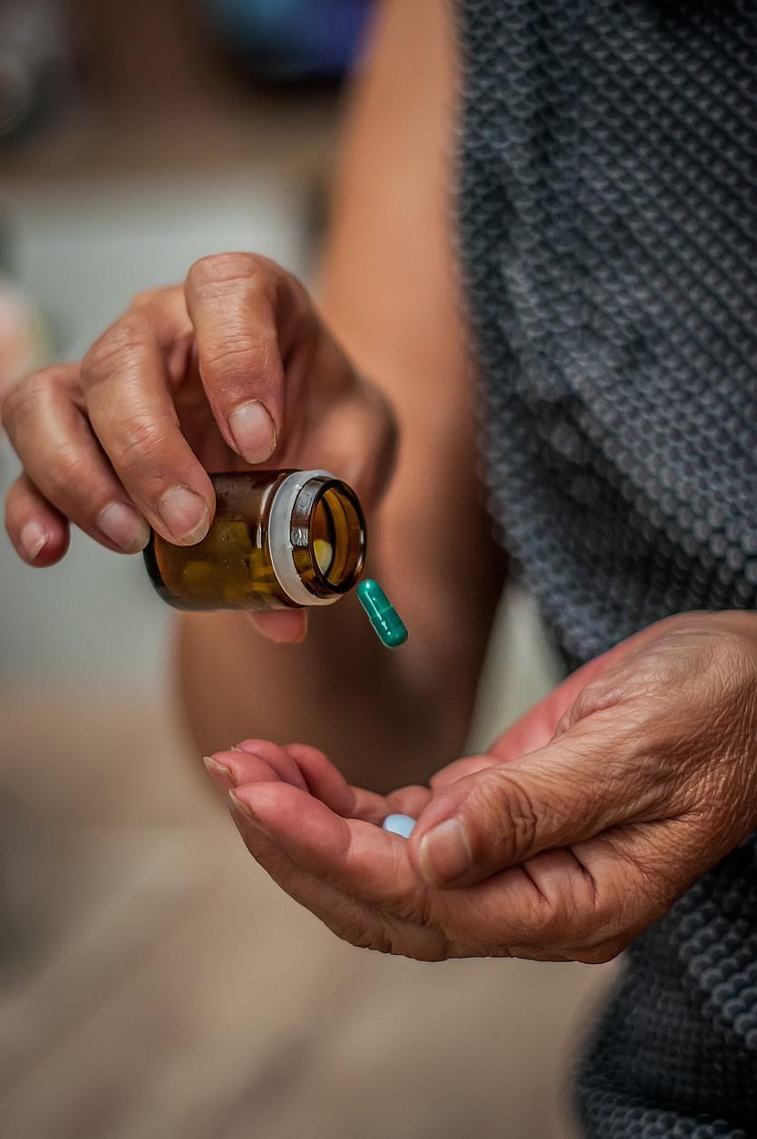 Capsule dropping into hand