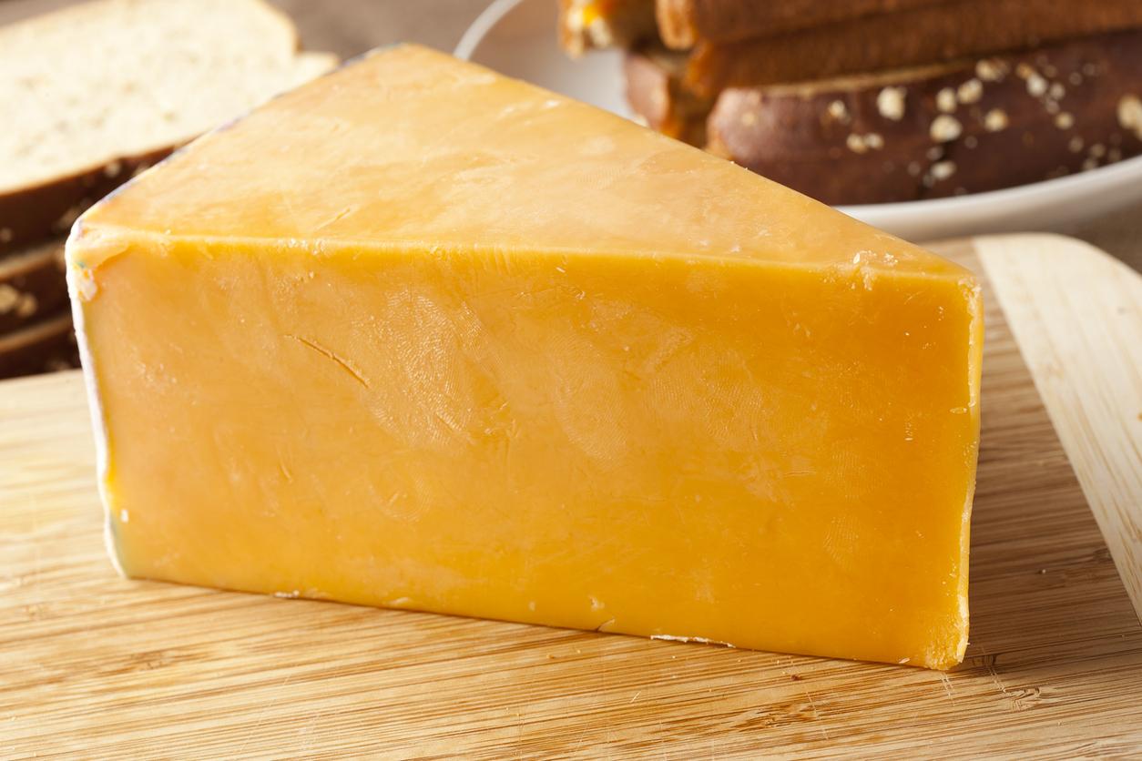 Wedge of cheddar cheese